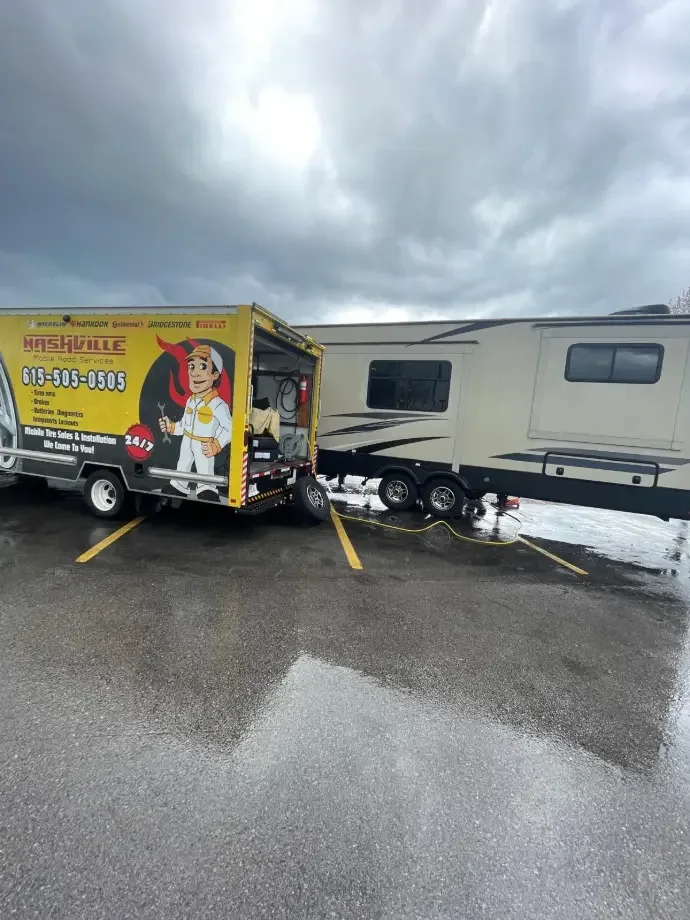 Mobile roadside service working beside an RV
